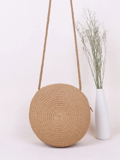Bolso redondo con asas