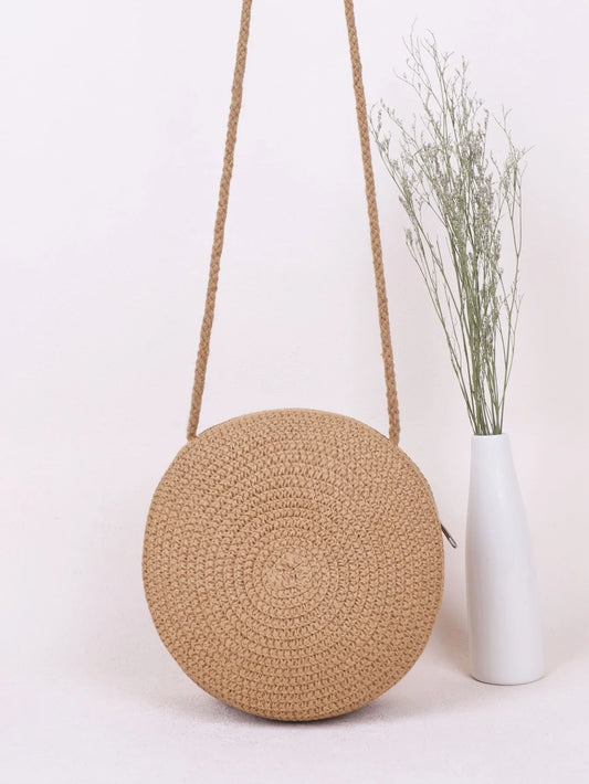 Bolso redondo con asas
