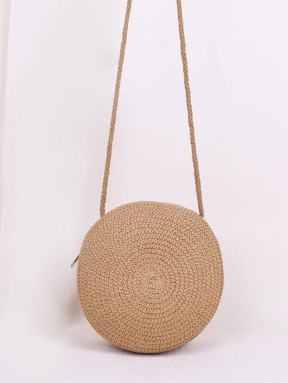 Bolso redondo con asas